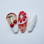 Macro close-up 3D cherry ruby rhinestone arc blood orange citrus slice white swirl gel nail art — LuxepressCo