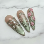 Close-up macro sage green chrome floral filigree gold swirl reusable salon-quality press-on nails marble background — LuxepressCo
