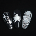 Macro close-up 3D silver star charm and heart chrome foil salon-quality press-on nails — LuxepressCo
