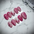 Pink Shell 3D Press-On Nails full set on marble surface, 45 degree angle