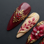 Macro close-up burgundy rhinestone gold filigree custom press-on nails dramatic lighting — LuxepressCo