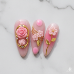 Close-up pink daisy flower gold swirl pearl bead custom press-on nails marble background glossy texture — LuxepressCo