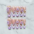 Flat lay top-down full set 10 lavender 3D floral custom press-on nails arranged on white marble — LuxepressCo