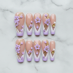 Flat lay top-down full set 10 lavender 3D floral custom press-on nails arranged on white marble — LuxepressCo
