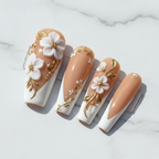 Macro close-up nude coffin white french tip 3D floral gold vine reusable nails glossy texture — LuxepressCo