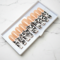 Nude peach black botanical swirl feather art custom press-on nails long square full set on marble — LuxepressCo