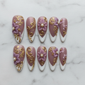 Flat lay top-down full set 10 baroque floral custom press-on nails purple gold pearl white marble — LuxepressCo