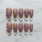 Flat lay top-down full set 10 baroque floral custom press-on nails purple gold pearl white marble — LuxepressCo
