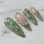 Macro close-up green marble pearl rhinestone 3D shell blush pink custom press-on nails — LuxepressCo