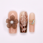 Macro close-up chocolate ombre rose gold foil botanical 3D flower gold heart salon-quality nails — LuxepressCo