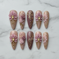 Flat lay top-down full set 10 3D floral custom press-on nails pink gold rhinestone — LuxepressCo