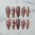 Flat lay top-down full set 10 3D floral custom press-on nails pink gold rhinestone — LuxepressCo