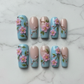 Flat lay top-down full set 10 salon-quality cherry blossom press-on nails — LuxepressCo