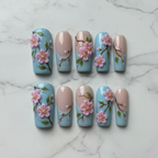 Flat lay top-down full set 10 salon-quality cherry blossom press-on nails — LuxepressCo