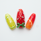 Macro close-up lime slice strawberry green bow crystal rhinestone orange citrus jelly nail art — LuxepressCo