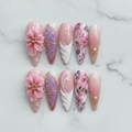 Flat lay top-down full set 10 luxury custom press-on nails 3D floral butterfly pink purple ombre — LuxepressCo