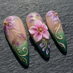 Close-up 3D cherry blossom floral nail art purple pink gold custom press-on nails dramatic lighting — LuxepressCo