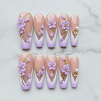 Flat lay top-down full set 10 lavender 3D flower gold vine French tip pearl salon-quality nails white marble — LuxepressCo