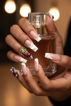 Dark-skin lifestyle Y2K cherry billiard custom press-on nails coffin nude pink holding perfume — LuxepressCo