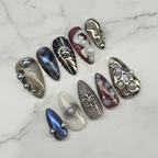 Gothic dark marble cat eye chrome 3D sun charm custom press-on nails almond full set on marble — LuxepressCo
