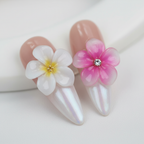 Macro close-up nude aurora mother-of-pearl shimmer 3D white pink plumeria crystal salon-quality almond press-on nails — LuxepressCo