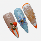 Macro close-up sky blue embossed chrysanthemum 3D orange cherry cluster gold bee charm salon-quality stiletto press-on nails — LuxepressCo