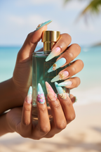 Dark-skin hands holding aqua perfume wearing pastel ocean jelly glass hibiscus reusable press-on nails — LuxepressCo
