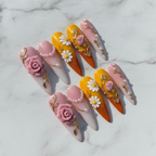 Studio hero shot full set 10 stiletto 3D floral rose daisy custom press-on nails white marble background — LuxepressCo