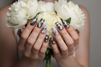 Fair-skin hands wearing silver chrome liquid metal holographic plaid custom press-on nails holding white peonies — LuxepressCo