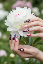 Light-skin hands holding white peony wearing purple marble 3D floral custom press-on nails — LuxepressCo