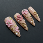 Macro close-up 3D pink floral rhinestone pearl custom press-on nails dramatic lighting — LuxepressCo