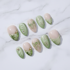 Sage green ombre French tip gold wire butterfly bow daisy custom press-on nails full set marble background studio — LuxepressCo