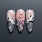 Macro close-up Japanese crane ink art custom press-on nails silver shimmer dramatic lighting — LuxepressCo