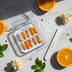 Luxury unboxing acrylic nail box nude orange citrus flower gold star press-on nails with orange and cream flower props — LuxepressCo