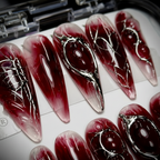 Macro close-up crimson jelly void eye silver wire art custom press-on nails — LuxepressCo