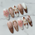 3D pink flower gold frame magnolia marble press-on nails hero shot white marble studio custom press-on nails — LuxepressCo