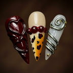 Macro close-up burgundy 3D swirl silver coil leopard cherry custom press-on nails detail — LuxepressCo