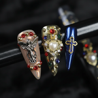 Macro close-up 3D silver angel gold cross gem rosary custom press-on nails detail — LuxepressCo