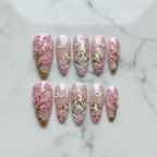 Flat lay top-down full set 10 cherry blossom mountain 3D salon-quality nails white marble — LuxepressCo