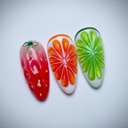 Macro close-up red strawberry green bow orange citrus starburst green lime slice crystal rhinestone jelly nail art — LuxepressCo