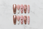 Flat lay top-down full set 10 rose gold chrome 3D floral blush pink reusable press-on nails marble — LuxepressCo