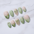 Matcha garden gold wire butterfly bow daisy custom press-on nails sage green ombre French tip clover charm full set flat lay — LuxepressCo