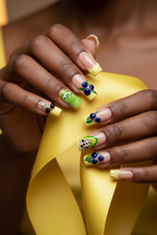 Dark skin hands wearing citrus French garden square custom press-on nails holding luxury yellow silk ribbon — LuxepressCo