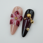 Macro close-up nude blush hand-painted dark magenta flower gold stamen black gold bell salon-quality press-on nails — LuxepressCo
