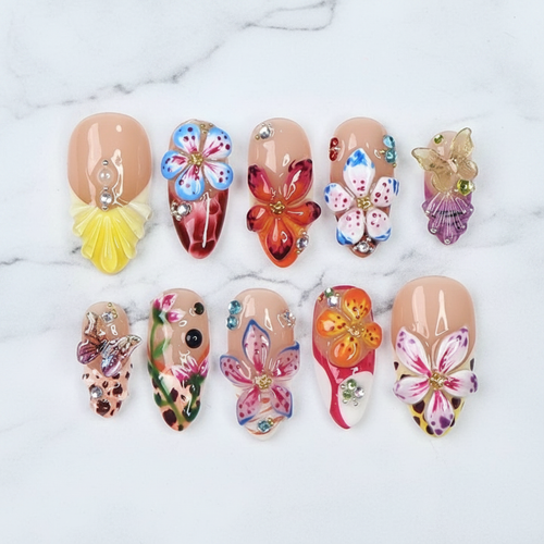 3D floral butterfly orchid maximalist nude base rhinestone almond custom press-on nails full set on marble — LuxepressCo