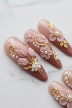 Macro close-up 3D pink tulip gold leaf pearl cluster almond press-on nails glossy finish salon-quality nails — LuxepressCo