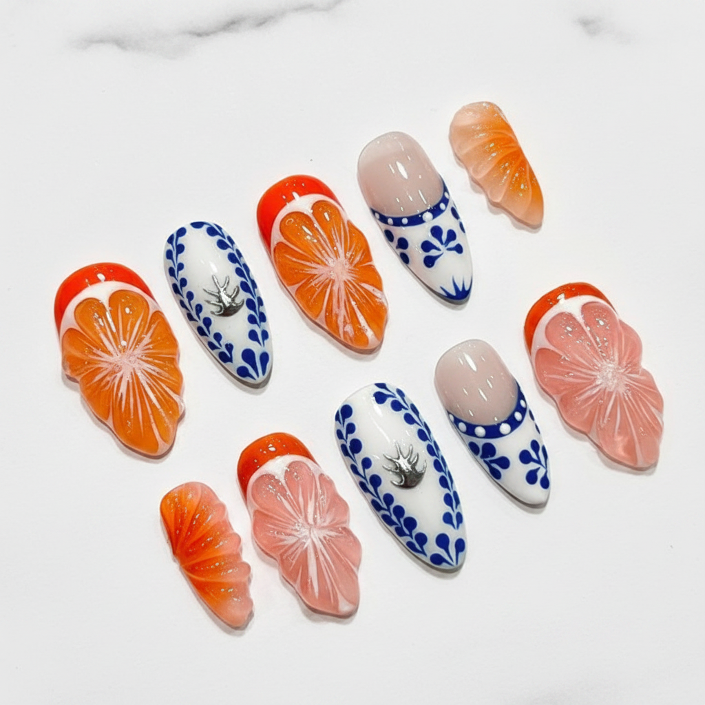 Citrus orange slice blue delft folk art hibiscus silver crab almond custom press-on nails full set on marble — LuxepressCo
