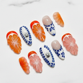 Citrus orange slice blue delft folk art hibiscus silver crab almond custom press-on nails full set on marble — LuxepressCo