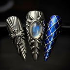 Macro close-up gunmetal armor 3D gothic cross blue harlequin moonstone custom press-on nails — LuxepressCo