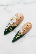 Close-up stiletto press-on nails nude blush forest green 3D floral gold swirl texture gloss — LuxepressCo